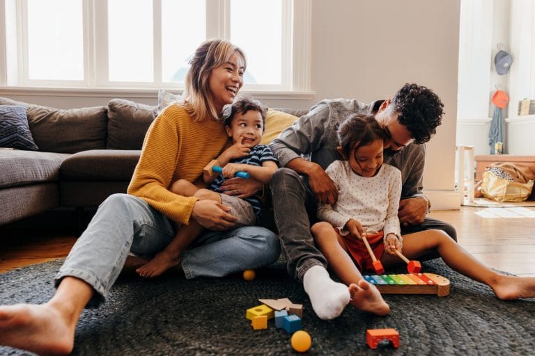 Stock image of a happy family that may not be aware of the risk of radon myths.